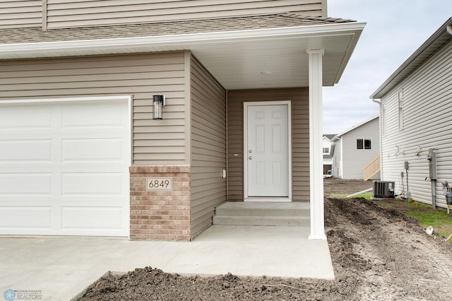 entrance to property featuring central AC unit