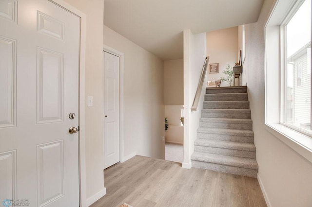 stairs with wood-type flooring