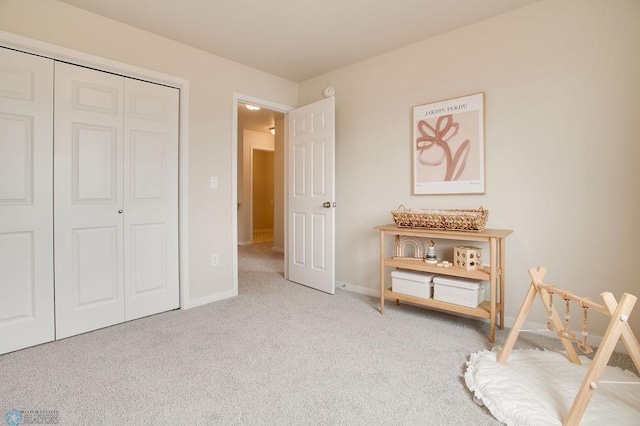 carpeted bedroom with a closet