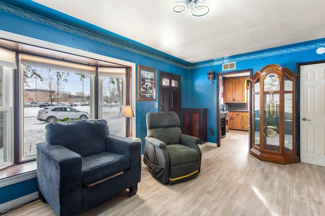 living area with light hardwood / wood-style floors