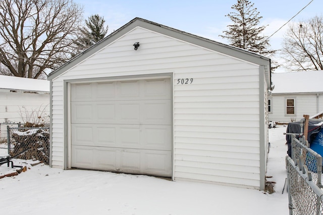 view of snow covered garage