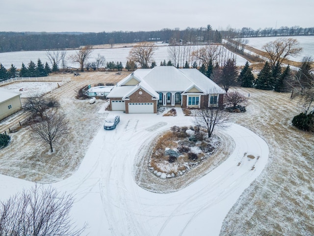 snowy aerial view with a rural view