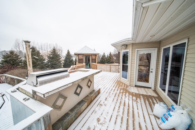 wooden terrace featuring an outdoor structure