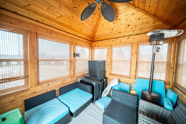 sunroom with a healthy amount of sunlight, wood ceiling, and ceiling fan