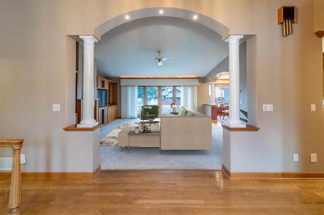 living room featuring ceiling fan and light hardwood / wood-style floors