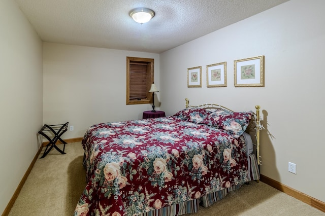 carpeted bedroom with a textured ceiling