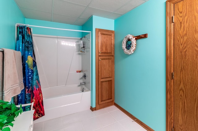 bathroom with tile patterned flooring and shower / tub combo