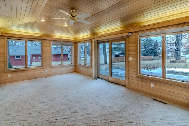 unfurnished sunroom with ceiling fan, wooden ceiling, and vaulted ceiling