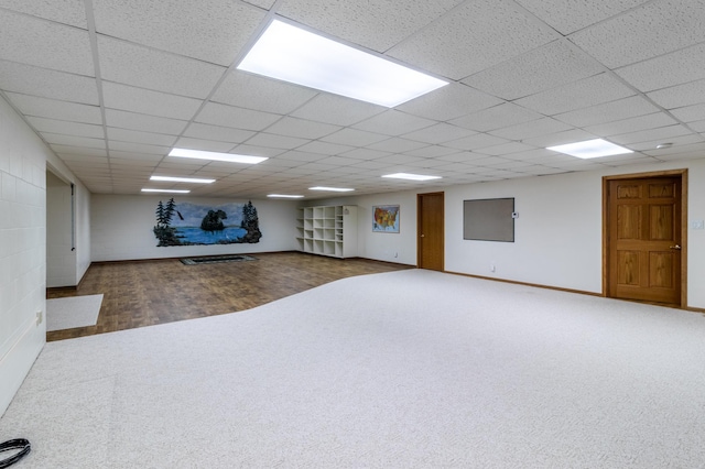 basement featuring a paneled ceiling