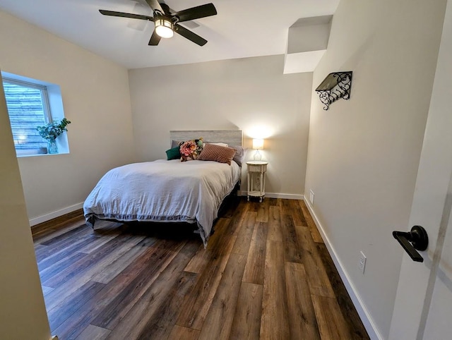 bedroom with ceiling fan and dark hardwood / wood-style flooring