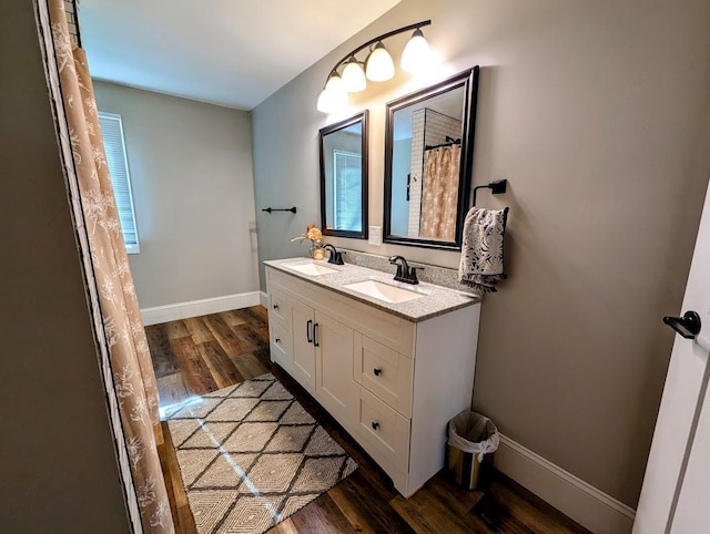 bathroom featuring vanity and hardwood / wood-style flooring