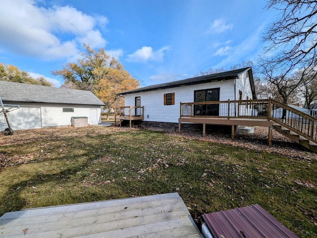 rear view of house with a wooden deck, a yard, and cooling unit