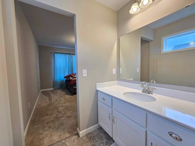 bathroom with vanity and a textured ceiling