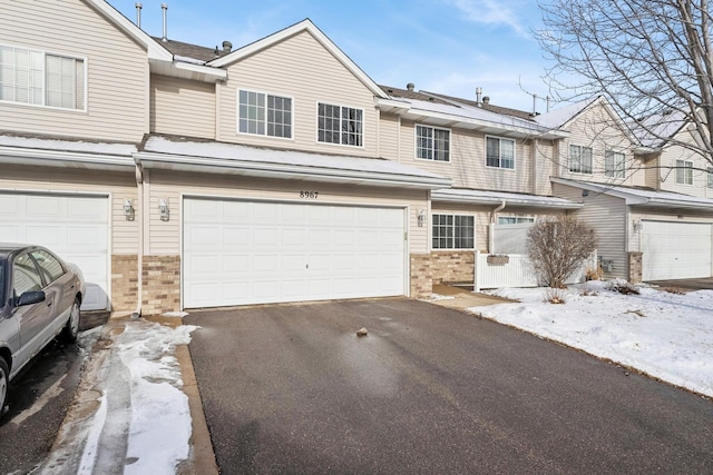 multi unit property featuring a garage