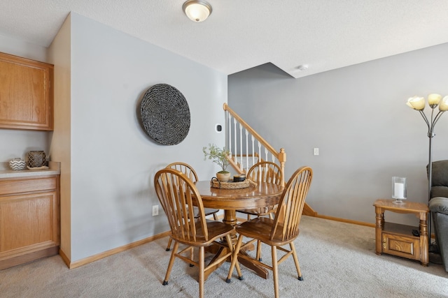 dining area with light carpet