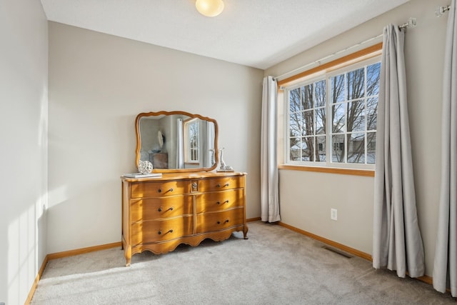 bedroom with light colored carpet