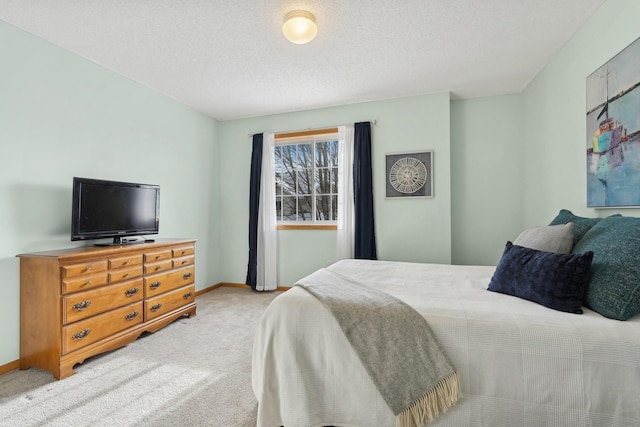 carpeted bedroom with a textured ceiling