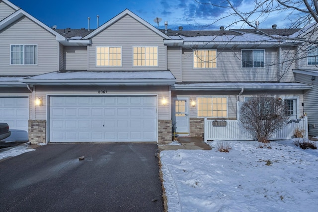 multi unit property featuring a garage