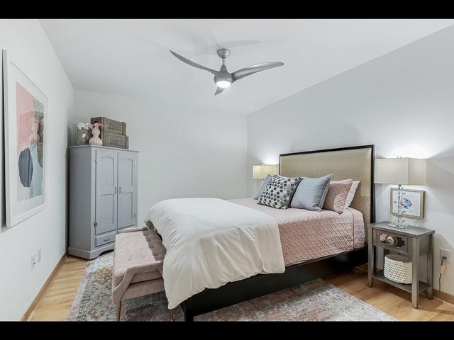 bedroom featuring ceiling fan and light hardwood / wood-style floors