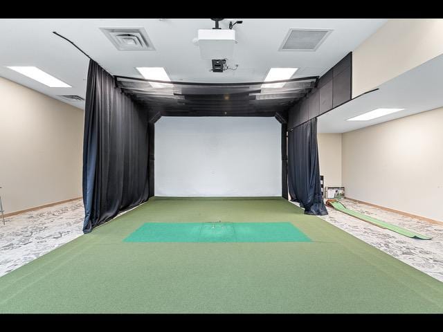 rec room featuring light colored carpet and golf simulator