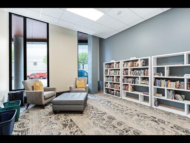 living area with a paneled ceiling