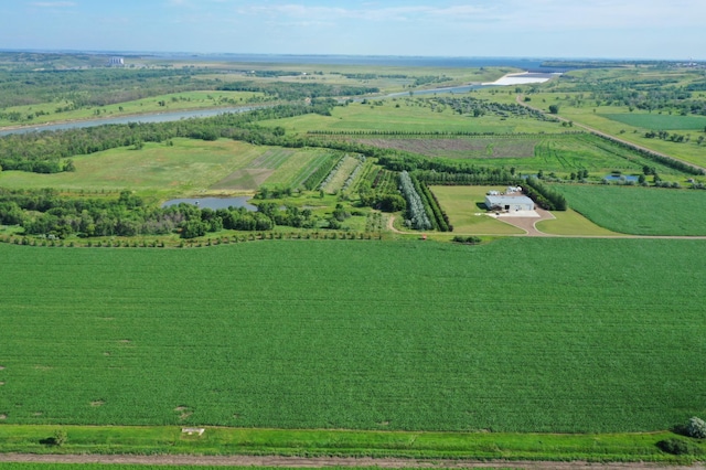 drone / aerial view with a rural view and a water view