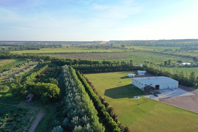 birds eye view of property with a rural view