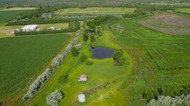 birds eye view of property featuring a rural view and a water view