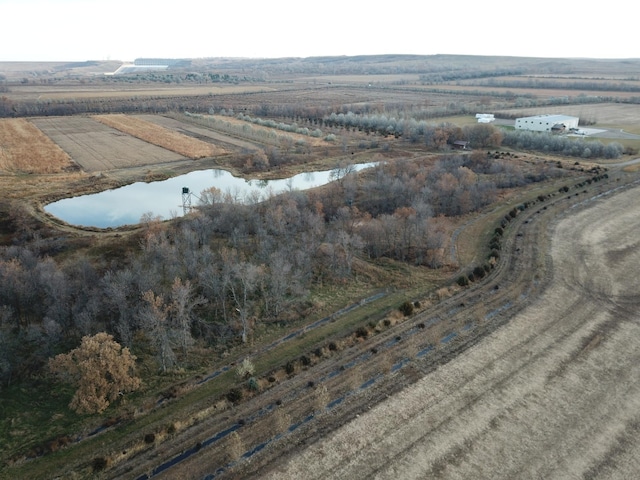 drone / aerial view featuring a water view and a rural view