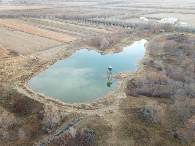 drone / aerial view with a rural view and a water view