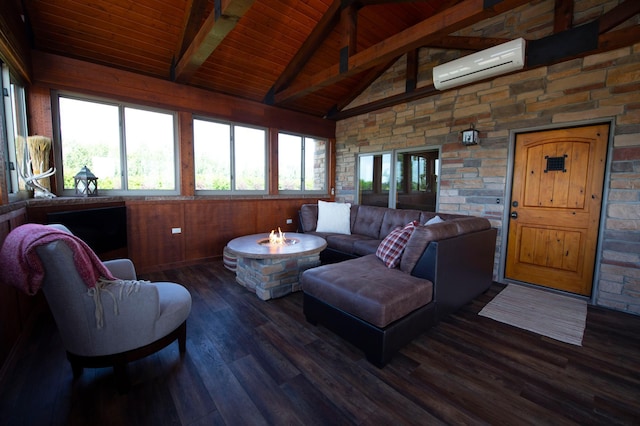 living room with a wall mounted air conditioner, vaulted ceiling with beams, dark hardwood / wood-style flooring, and a wealth of natural light