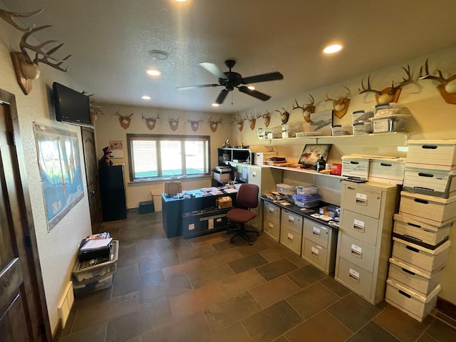 office space with ceiling fan and a textured ceiling