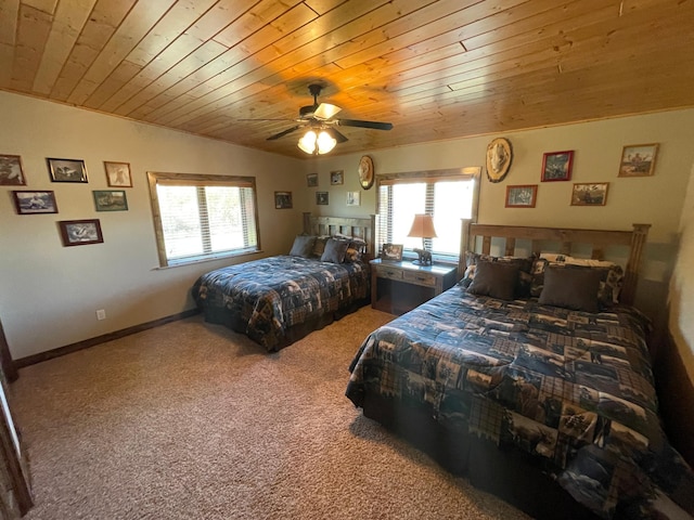 bedroom with ceiling fan, wood ceiling, carpet floors, and lofted ceiling