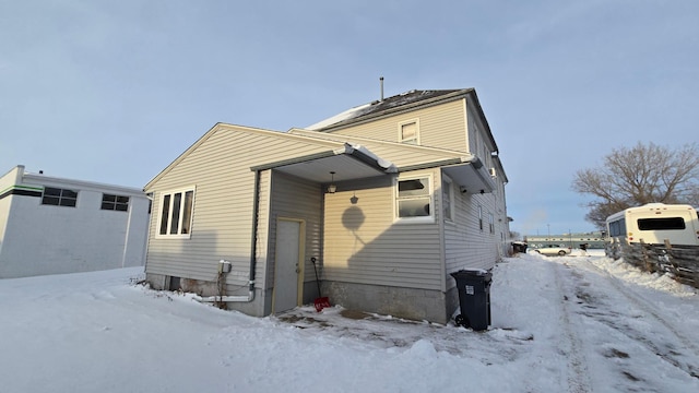 view of snow covered house