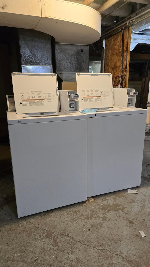 clothes washing area featuring washer and dryer