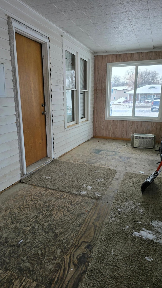 109 Greeley St W, Marshall, MN 56258 - spare room with wood walls and an AC wall unit