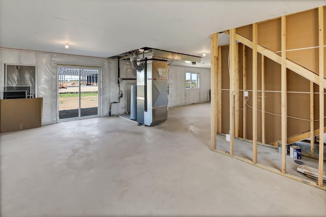 basement with heating unit and water heater