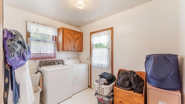 205 Broadway St SE, Isanti, MN 55040 - washroom featuring cabinet space, washer and clothes dryer, and light flooring
