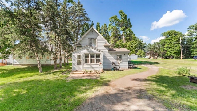 205 Broadway St SE, Isanti, MN 55040 - view of front facade featuring entry steps and a front yard
