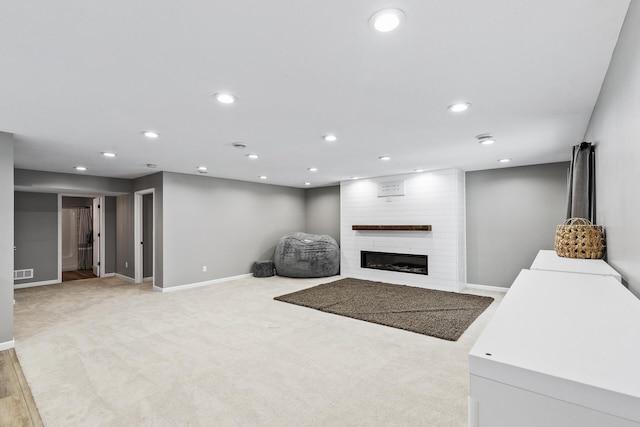 living room featuring a fireplace