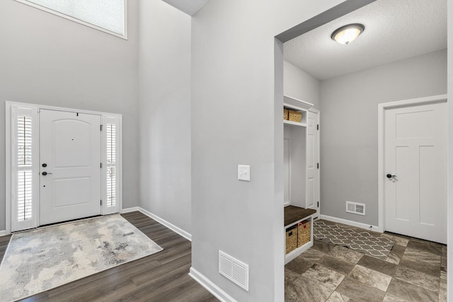 entrance foyer with a textured ceiling