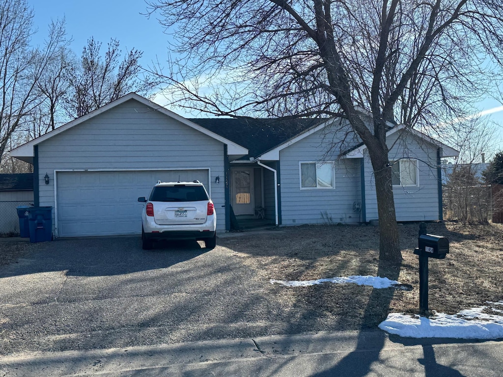 single story home featuring a garage