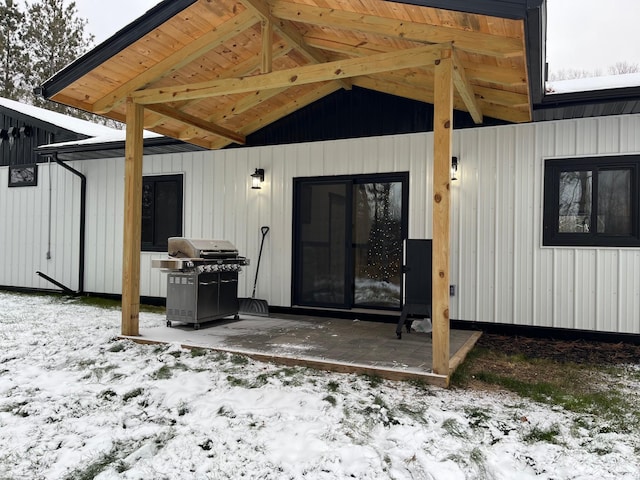 view of snow covered property entrance