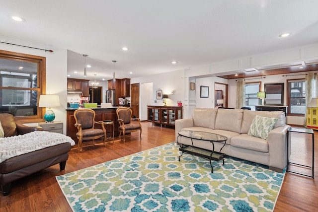 living room with dark hardwood / wood-style flooring