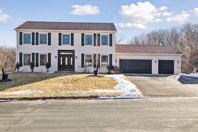 colonial inspired home with a garage