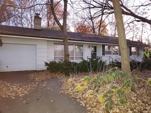 ranch-style home with a garage