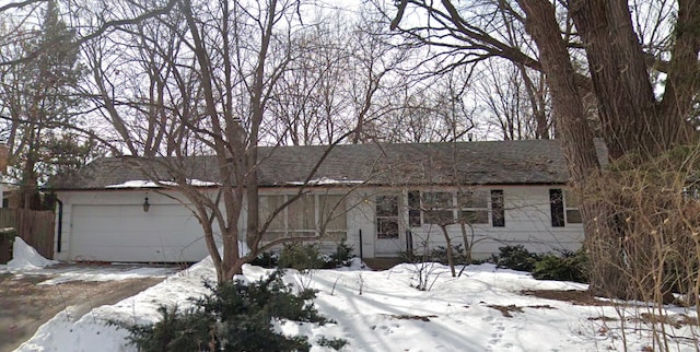 ranch-style home featuring a garage