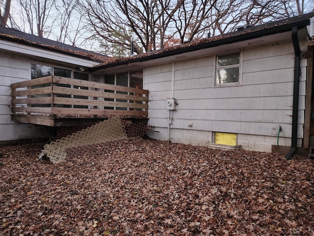 view of property exterior featuring a wooden deck