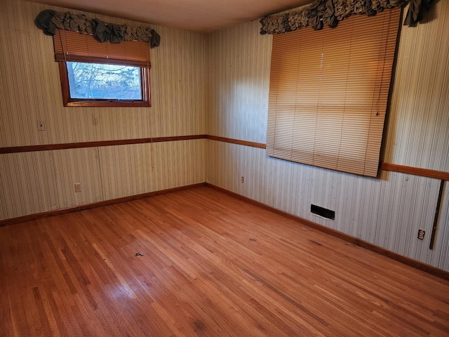 spare room featuring light hardwood / wood-style floors