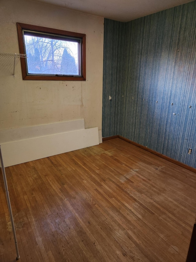 spare room featuring hardwood / wood-style flooring